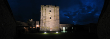 26995-27001 Dunguaire Castle court yard at night.jpg